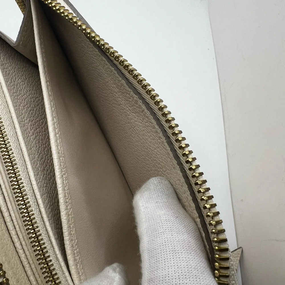 GUC Louis Vuitton Monogram Cream Empreinte Zippy Wallet - Picture 9 of 11
